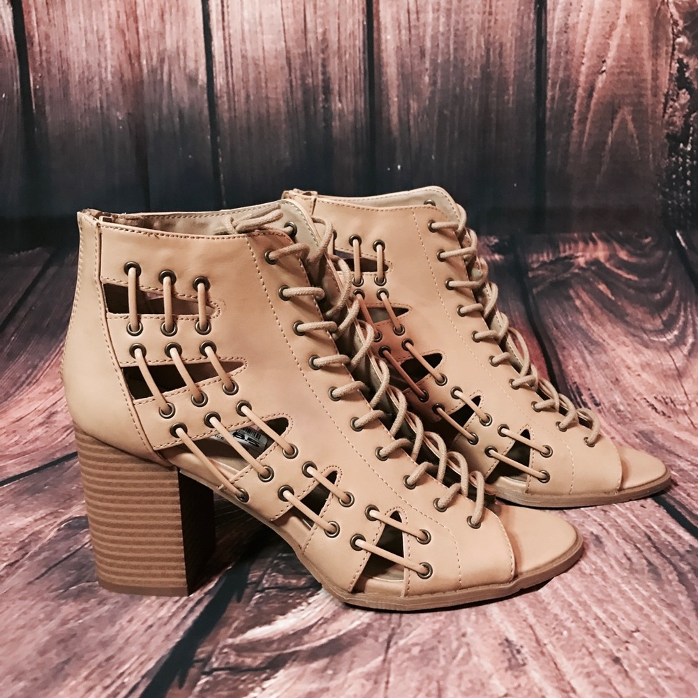 Open toed heals laced up the sides.